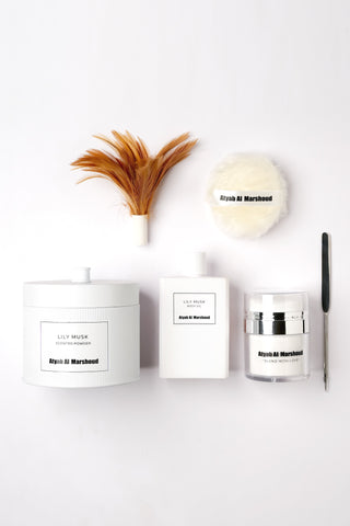 Three white containers with black labels on a white background by Atyab Al Marshoud.