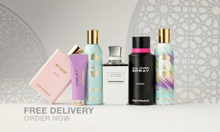 Collection of perfume bottles on a white surface with a decorative gray background