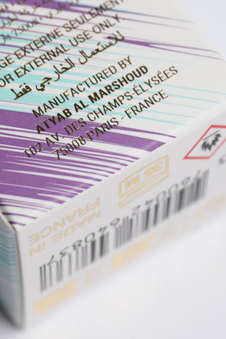 Close-up of a product packaging with text and branding details by Atyab Al Marshoud.