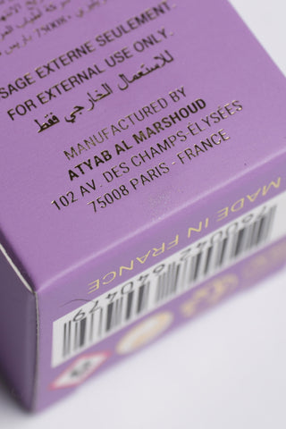 Close-up of a purple box with text and a barcode on a white background by Atyab Al Marshoud.
