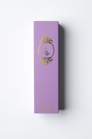Purple box with gold emblem on a white background by Atyab Al Marshoud.
