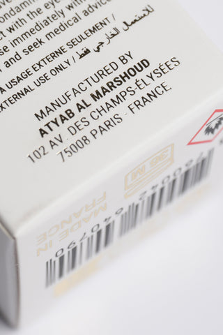 Product packaging with text and a barcode on a white background by Atyab Al Marshoud.