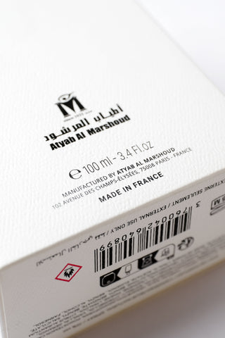 Close-up of a product label with branding and product details on a white background by Atyab Al Marshoud.