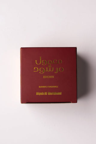 Red box with gold text on a white background by Atyab Al Marshoud.