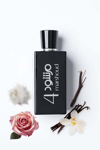 Black perfume bottle with 'Marshoud4' branding on a white background with flowers and vanilla beans by Atyab Al Marshoud.