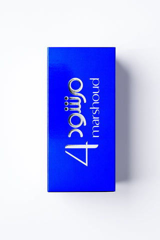 Blue rectangular box with '4guijo marshoud' branding on a white background by Atyab Al Marshoud.