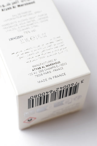 Product packaging with branding and manufacturing details on a white background by Atyab Al Marshoud.