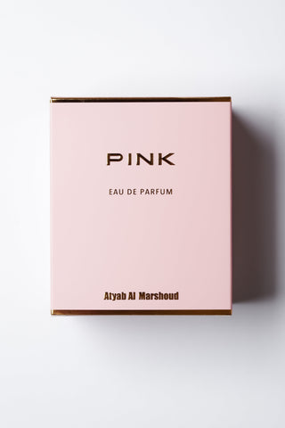 Pink eau de parfum box with brand name on a white background y Atyab Al Marshoud.