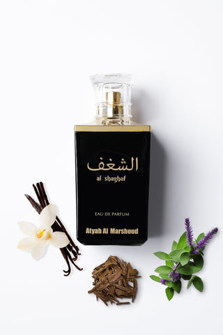 Perfume bottle with vanilla beans, flowers, and herbs on a white background by Atyab Al Marshoud.