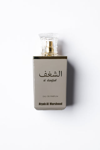 Perfume bottle with 'al shaghaf' branding on a white background by Atyab Al Marshoud.