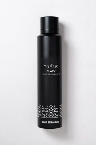 Black home fragrance bottle with white text on a white background by Atyab Al Marshoud.
